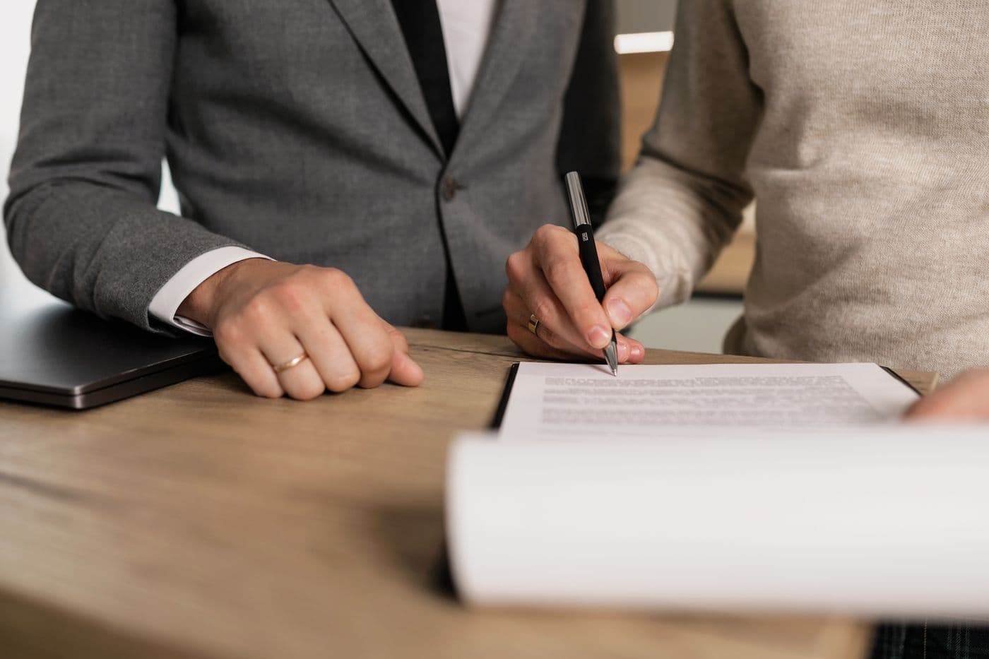 Real estate agent and client reviewing paperwork together