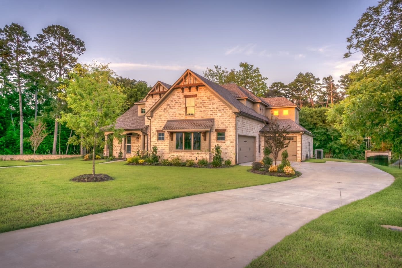 Stone-front home with a curved driveway