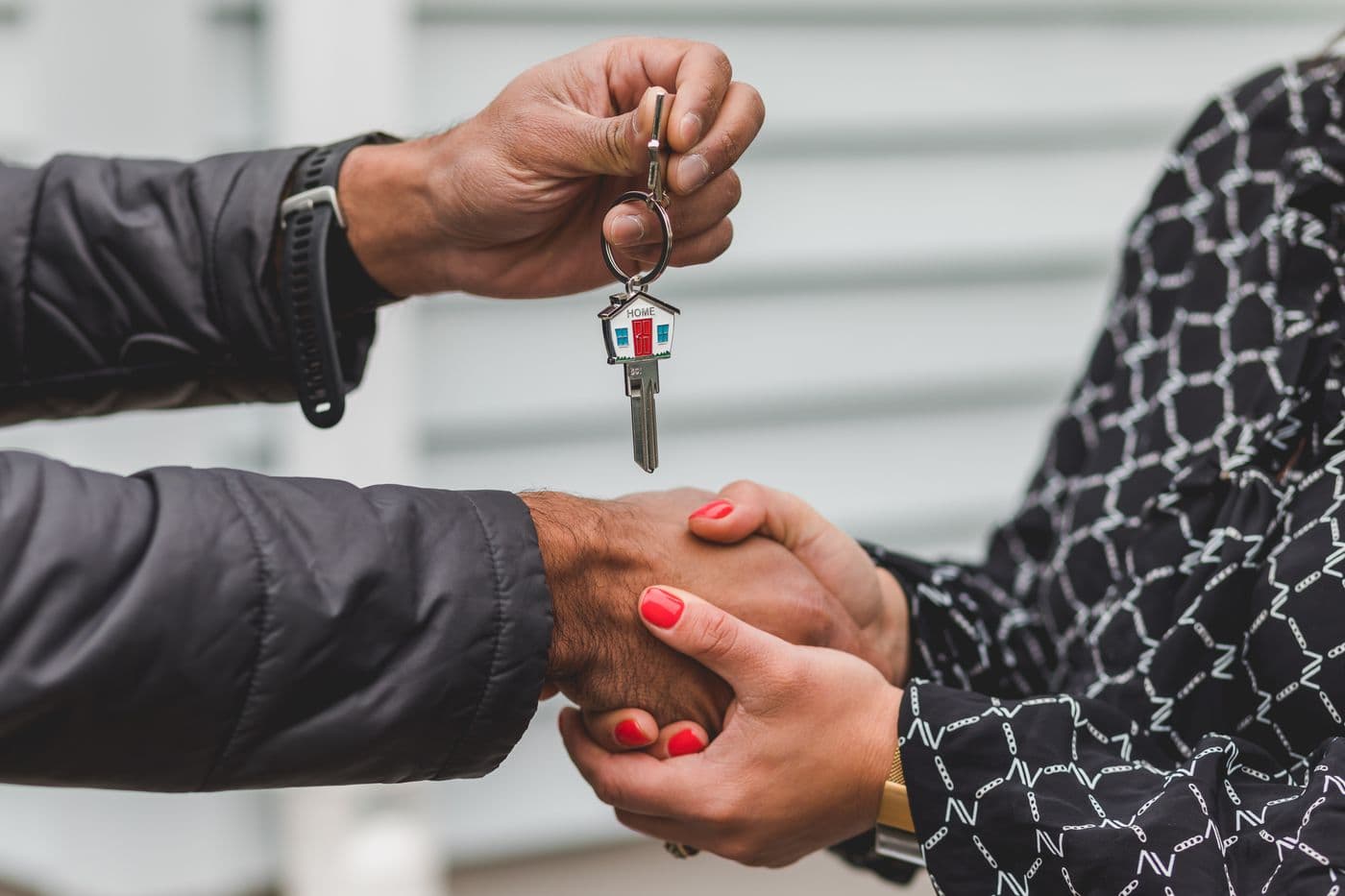 Handing over the keys after a successful home sale